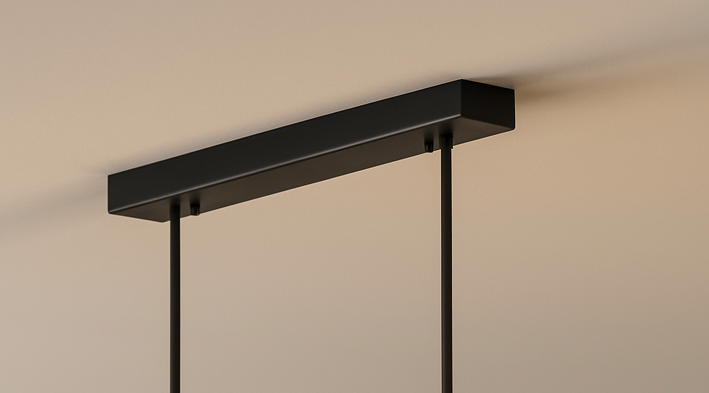 Close-up of the sleek black rectangular ceiling canopy and suspension cables for the rera linear LED pendant