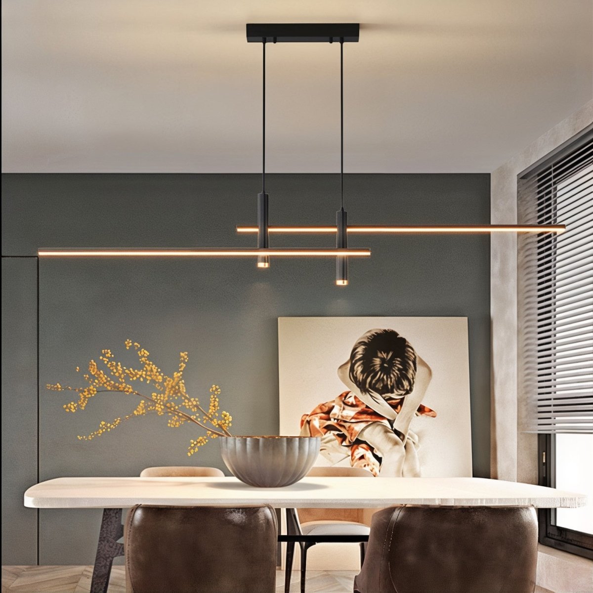 Modern rera matte black intersecting LED linear pendant light suspended above a contemporary dining table