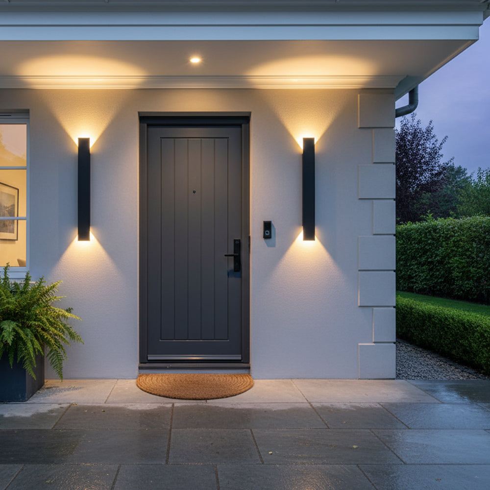 Pair of modern black LED reta porch lights beautifully framing a classic dark front door