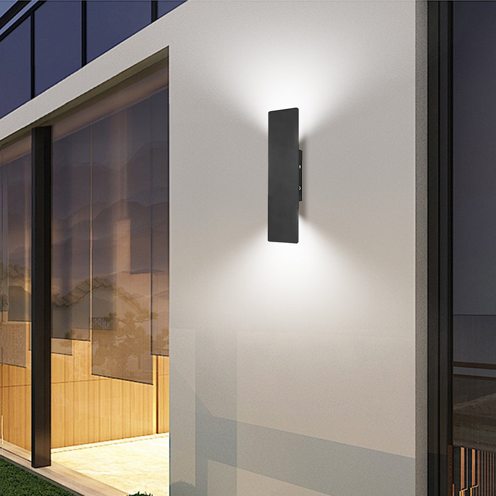 reta minimalist black exterior wall sconce providing warm up and down lighting