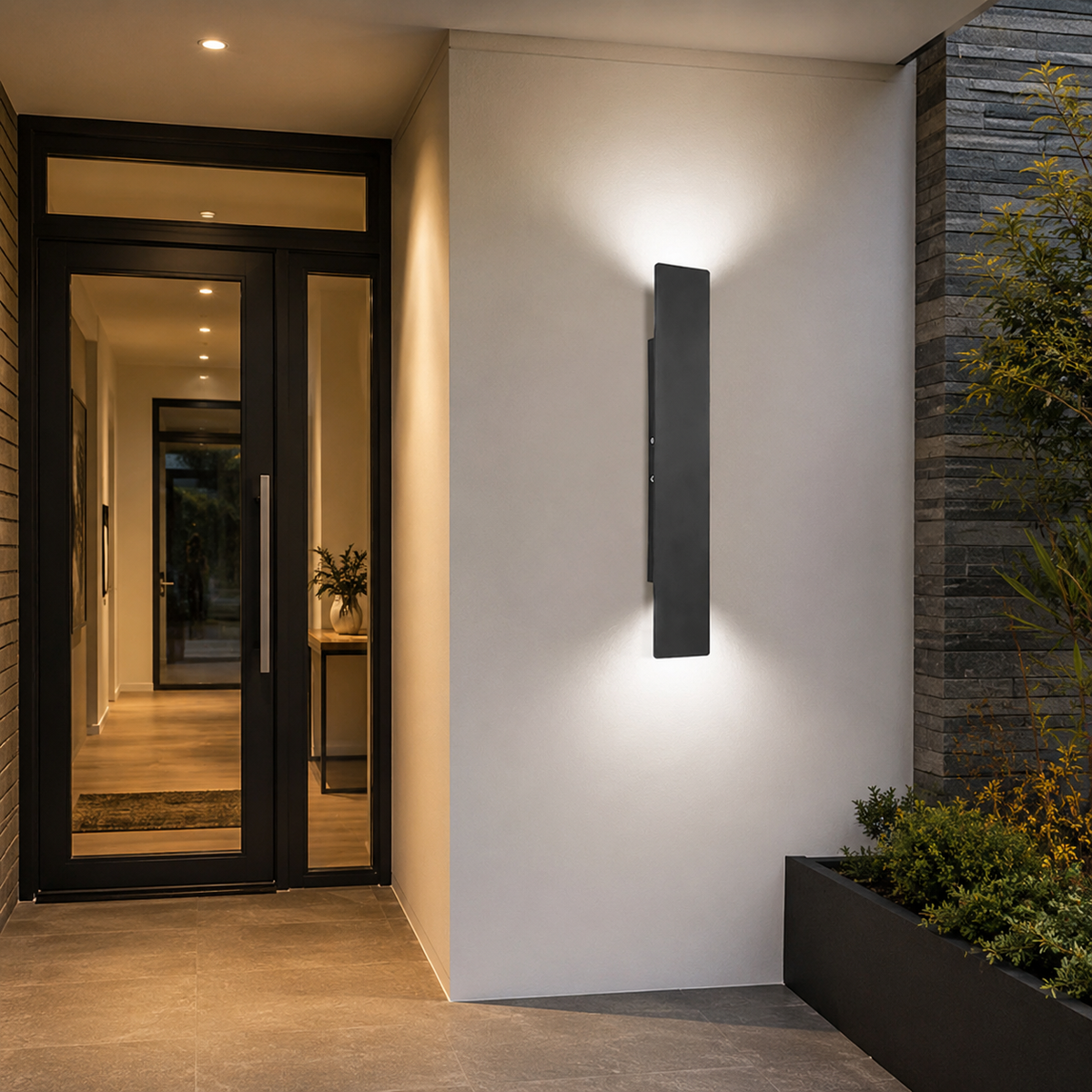 Tall black reta LED wall light installed next to a modern residential front door