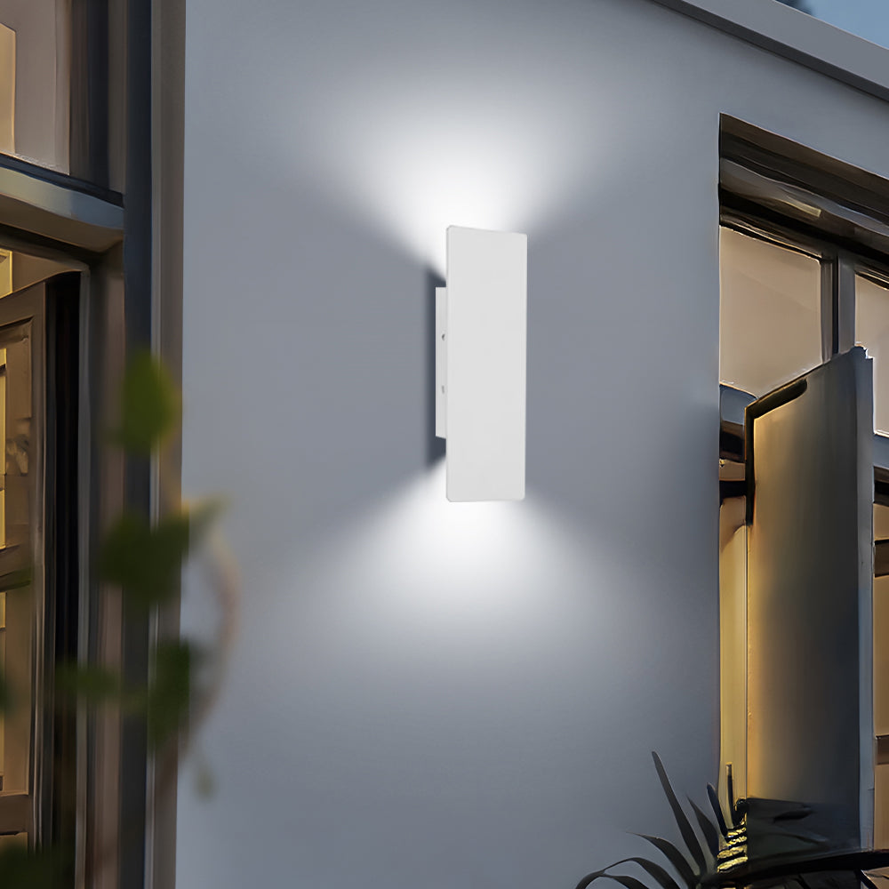 Bright white reta waterproof LED wall lamp illuminating a modern patio entrance