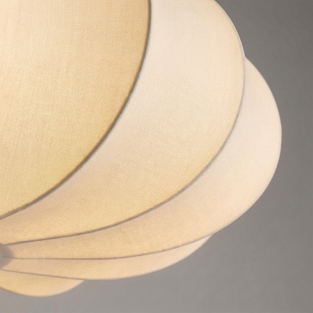 Rizqo pendant light showing the ribbed fabric shade detail, unlit, on a grey studio background