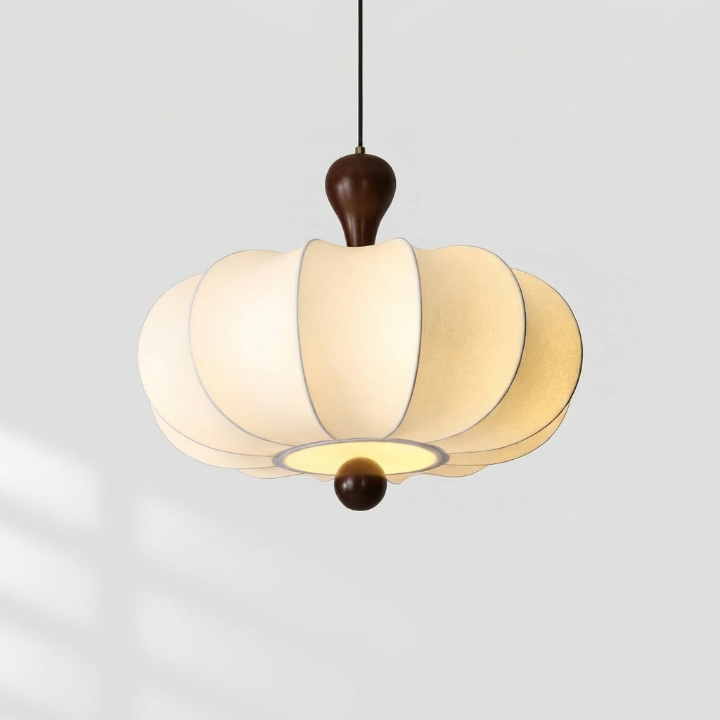 Rizqo sculpted fabric pendant light illuminated, alternate view on a grey studio background