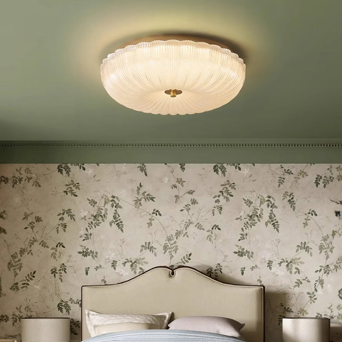 Retro ribbed glass rutyl ceiling light glowing warmly in a uniquely styled bedroom