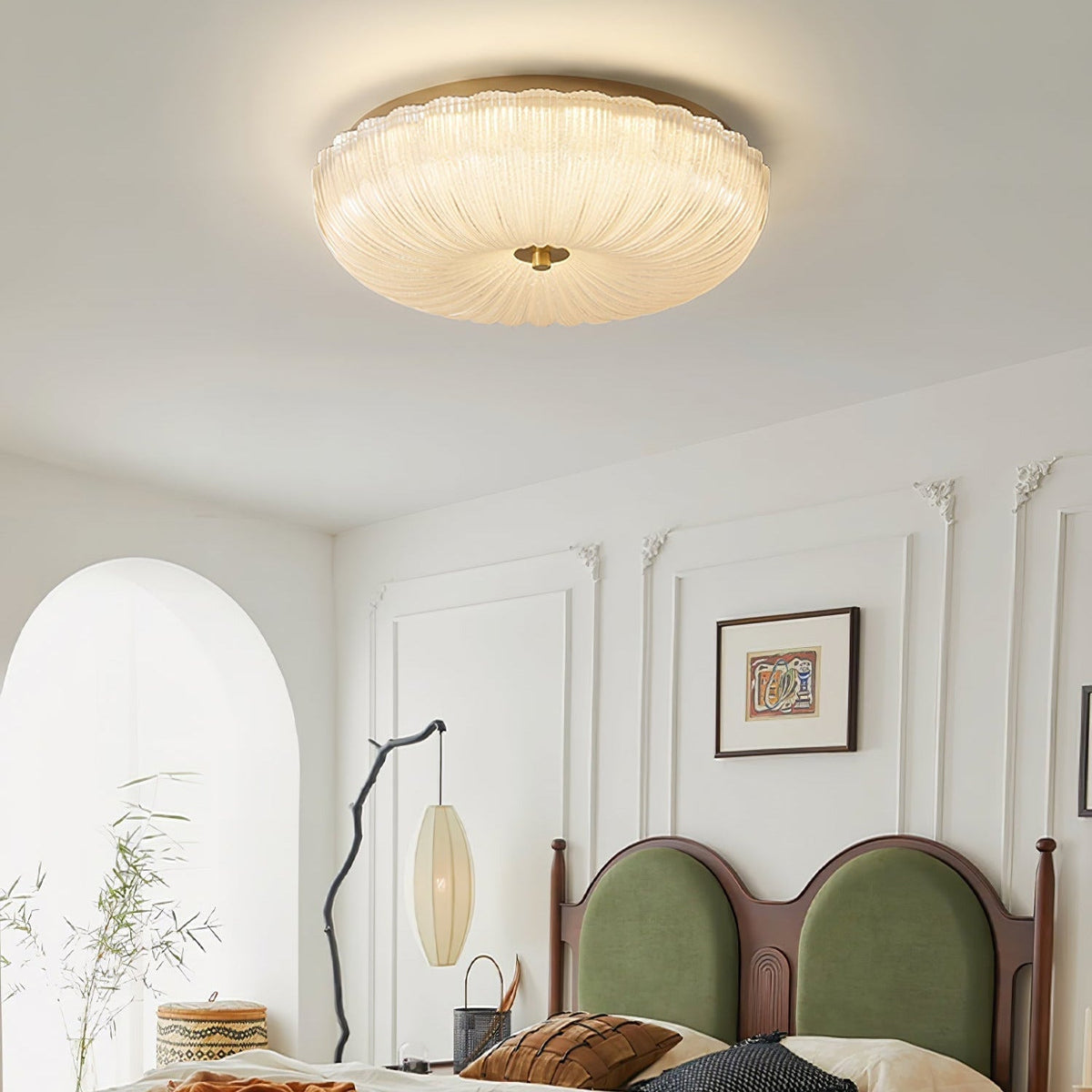 Vintage glass dome rutyl ceiling light casting a warm starburst pattern in a bedroom