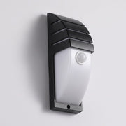 Strata black outdoor wall light with radar motion sensor lens on a grey studio background