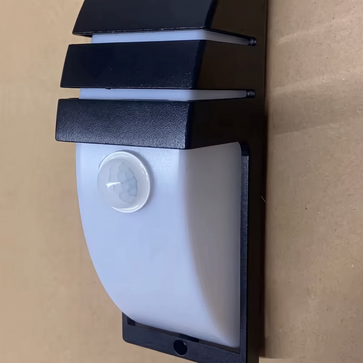 Close-up of the sensor lens on the front of the Strata outdoor wall light