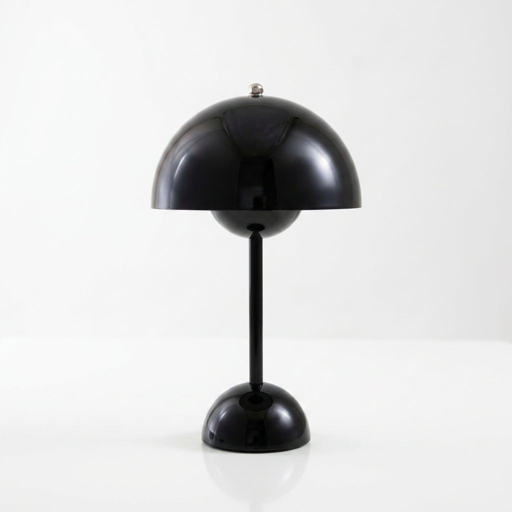A glossy sulba black mushroom-shaped table lamp with a domed shade, slim stem, and round base, photographed against a clean white studio background.