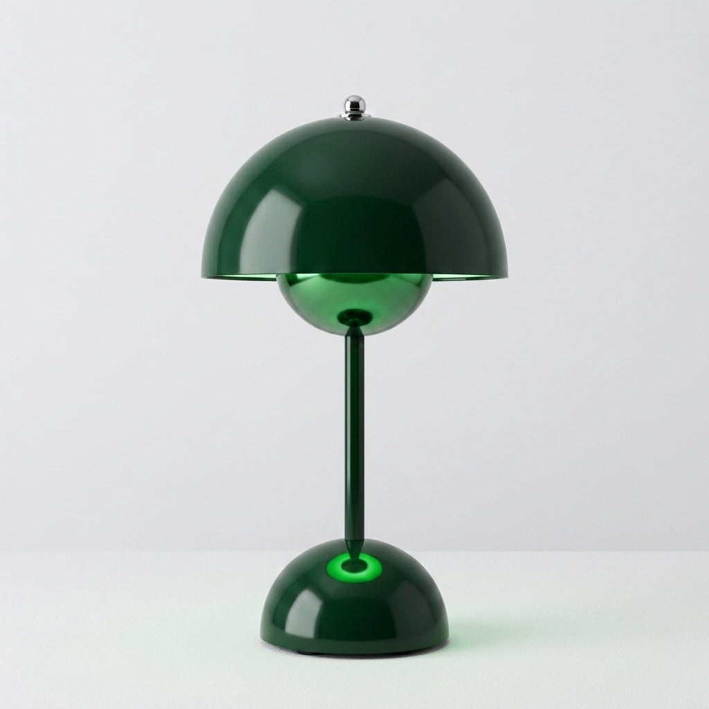 A modern sulba table lamp with a glossy dark green dome shade, a matching green stem, and a round green base, photographed against a clean light gray studio background.