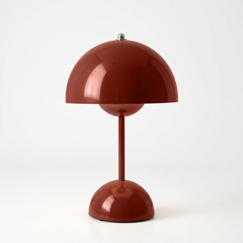 A modern sulba mushroom-shaped table lamp in a glossy terracotta red finish, featuring a dome-shaped shade, a slim stem, and a matching base on a clean white background.