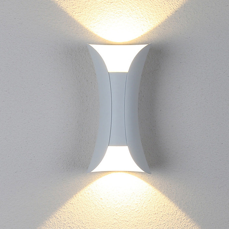 White teka up and down exterior wall light casting a warm, cosy V-shaped glow