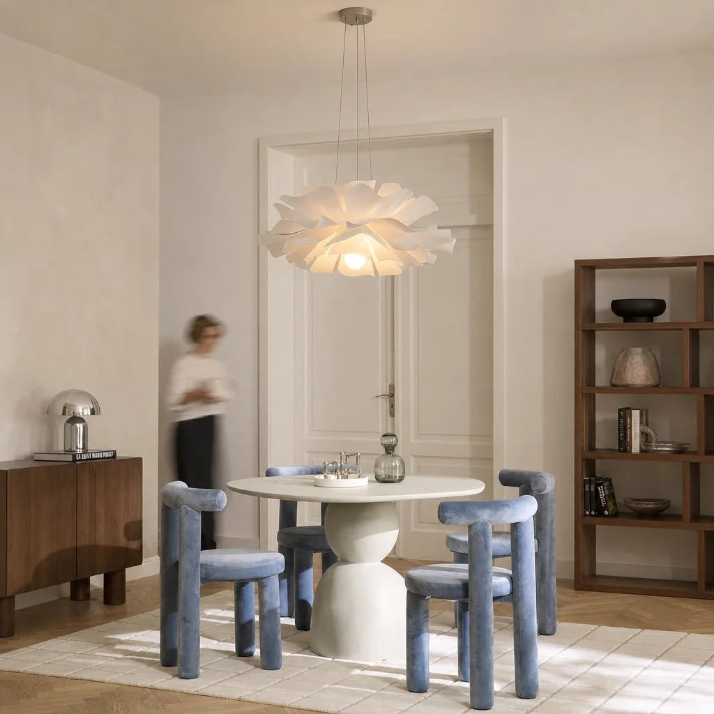 telba white lotus chandelier serving as a stunning focal point over a modern round dining table