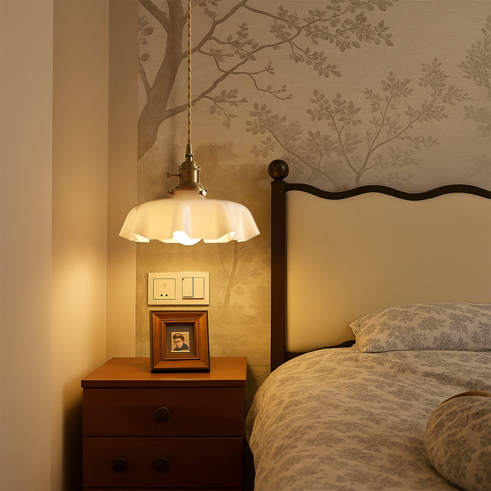 Vintage tugyl scalloped glass pendant styled as an elegant bedside reading light in a romantic bedroom