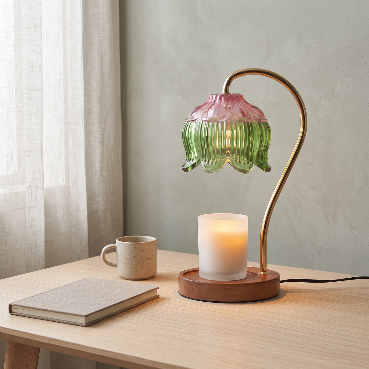 Tulvi green glass tulip candle warmer lamp lit on a wooden surface