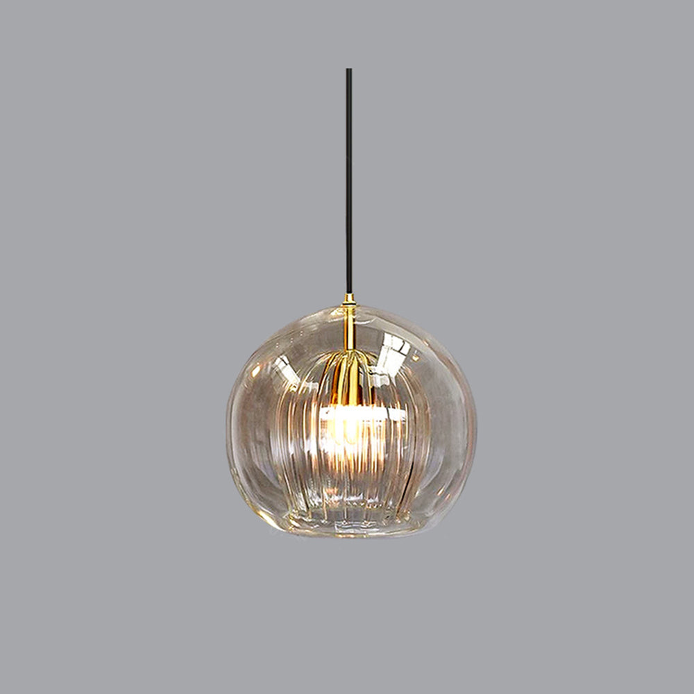 Amber tinted double-layer glass tuoj globe pendant isolated against a neutral grey background