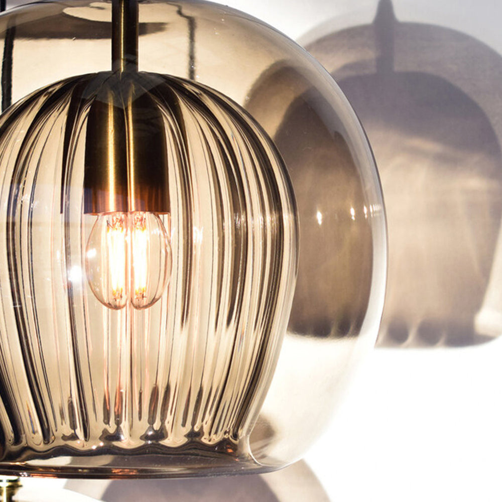 Close-up detail of the amber tuoj double-layer pendant showing the textured ribbed inner glass