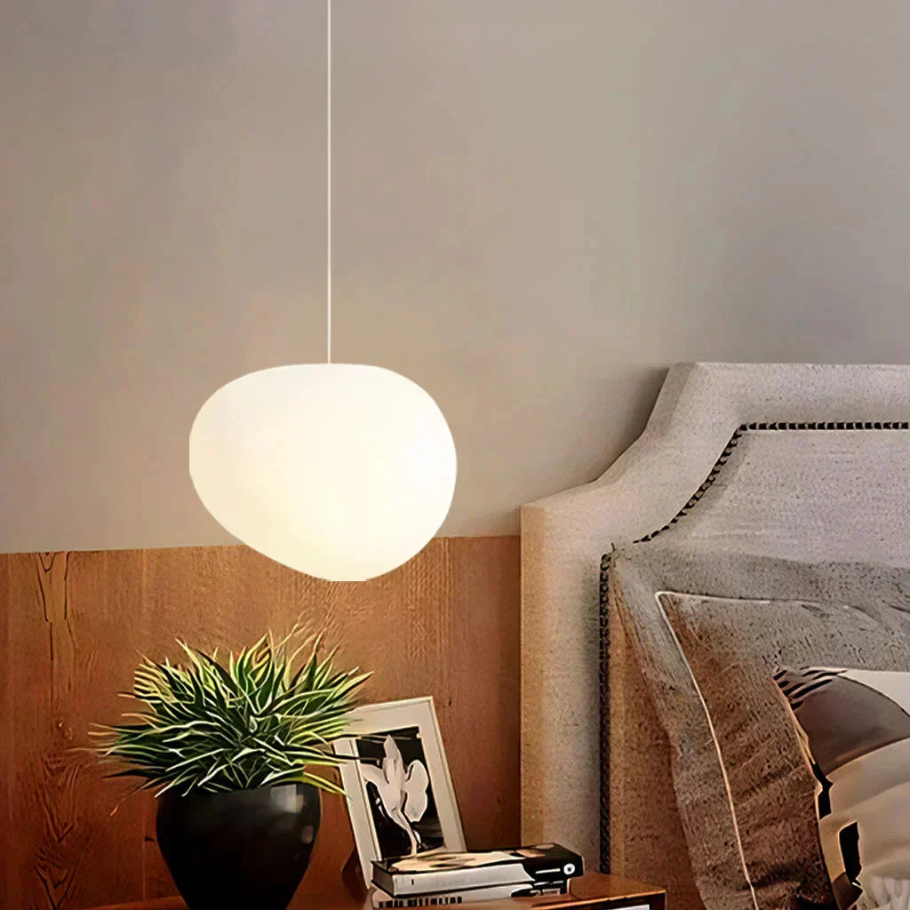 Wabi-Sabi glass tupel pebble pendant light styled as an elegant bedside reading lamp