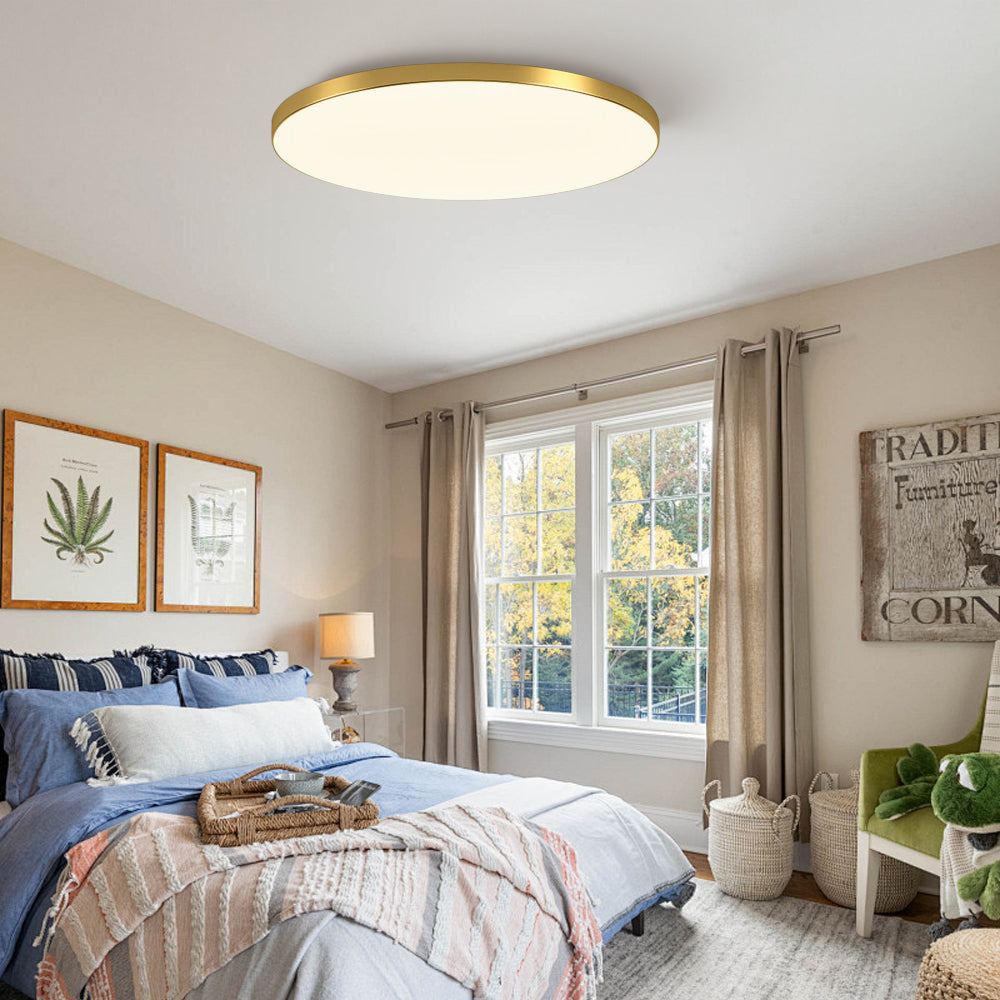 Ultra-thin gold flat panel tywa ceiling light in a bright, modern bedroom