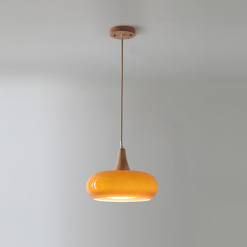 Single orange retro glass dome utul pendant light with a solid wood top