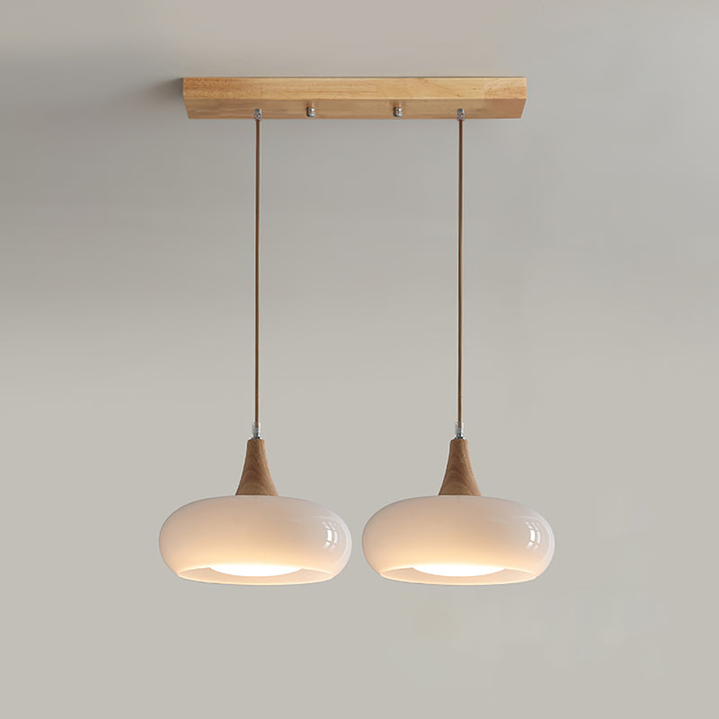 2-head utul white mid-century linear island light featuring a matching wooden ceiling plate