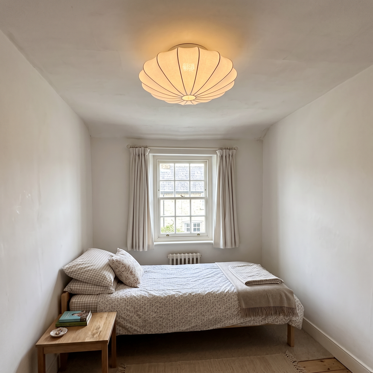40cm white silk flush mount ceiling light in a small British bedroom