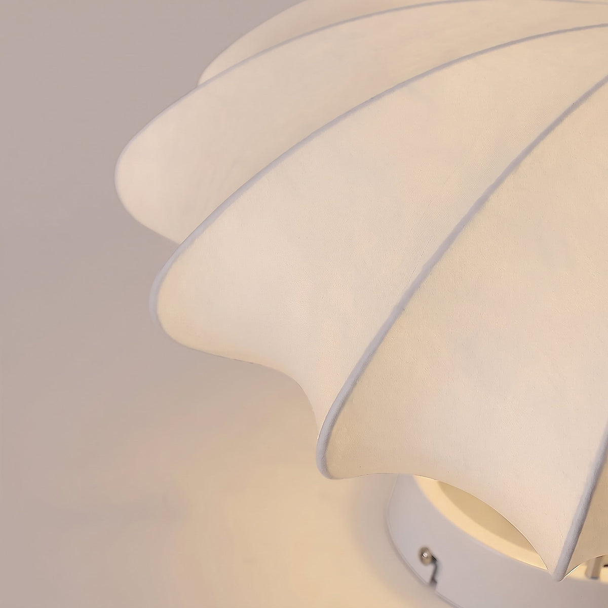 Close-up of the ribbed silk panels on the Varly flush mount ceiling light