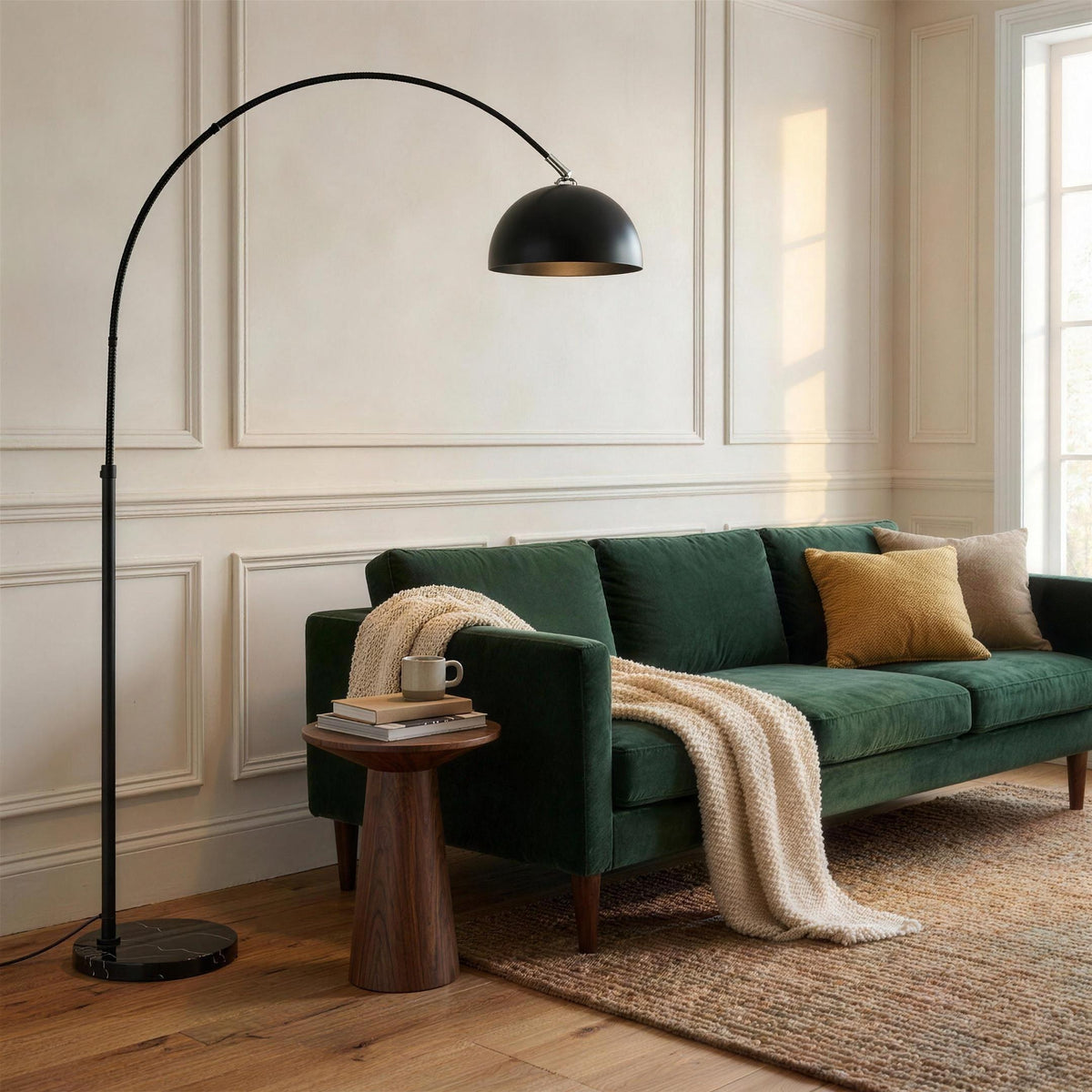 Black arc floor lamp with chrome-finish collar and marble base in a bright living room