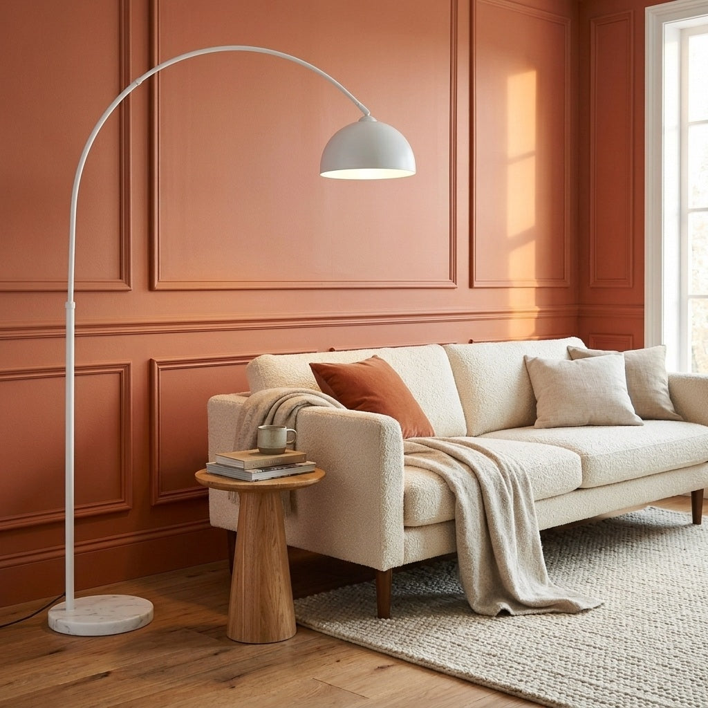White arc floor lamp with marble base and dome shade in a bright living room