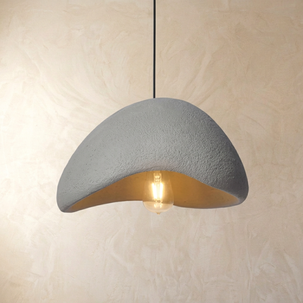 grey Japandi style resin viwa pendant showing the internal warm light bulb