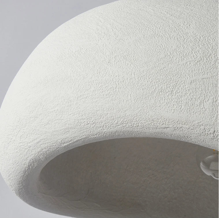 Close-up detail of the premium white resin texture on the asymmetrical viwa pendant light