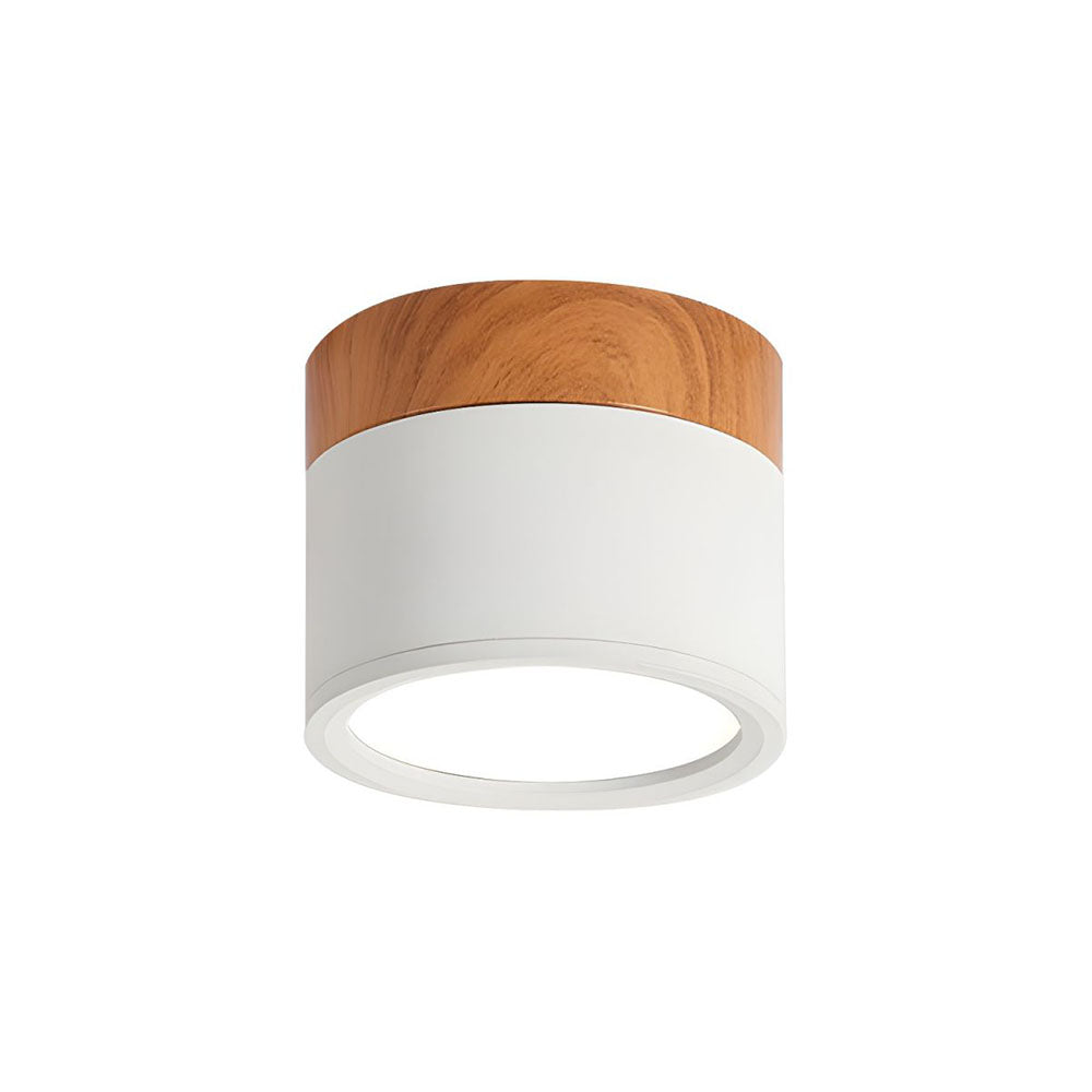 Close-up of a white aluminium cylinder flush vytri ceiling light with natural wood-effect trim