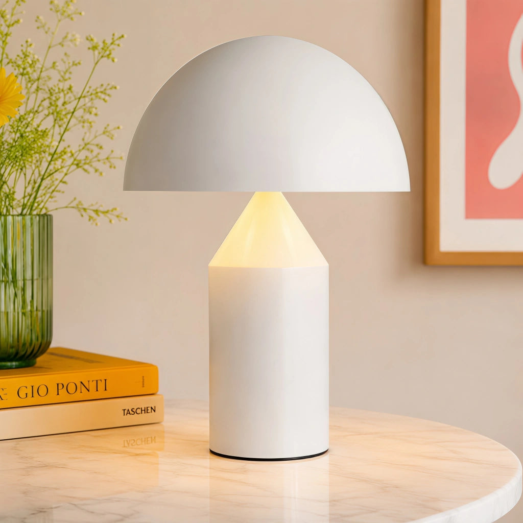 White wesk mushroom lamp styled elegantly on a round marble table with a book and plant