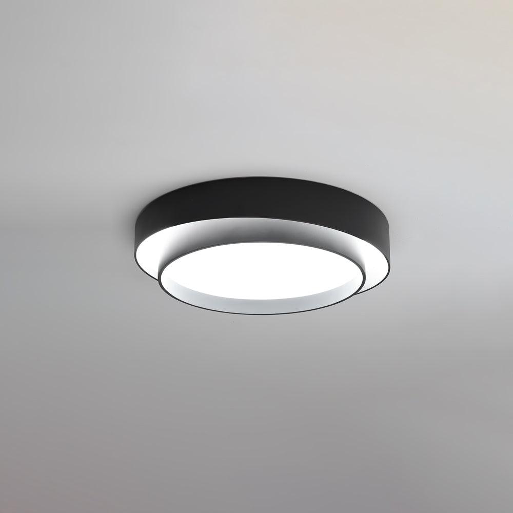 Illuminated wlip black concentric halo ceiling light demonstrating its uniform, glare-free light diffusion