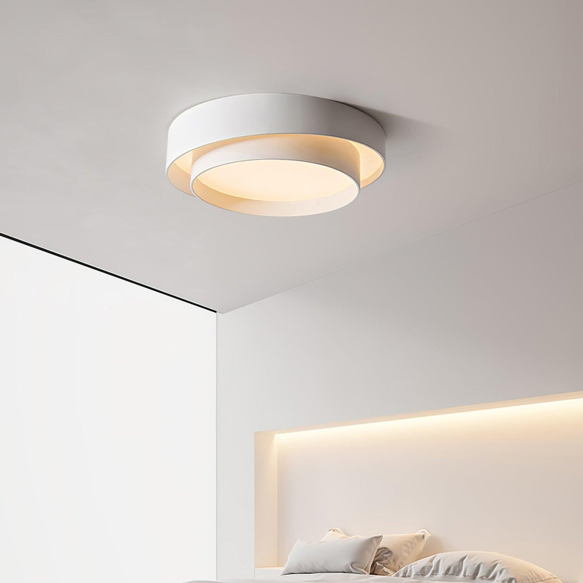 Minimalist wlip white LED ceiling lamp highlighting its sleek, low-profile design in a contemporary bedroom