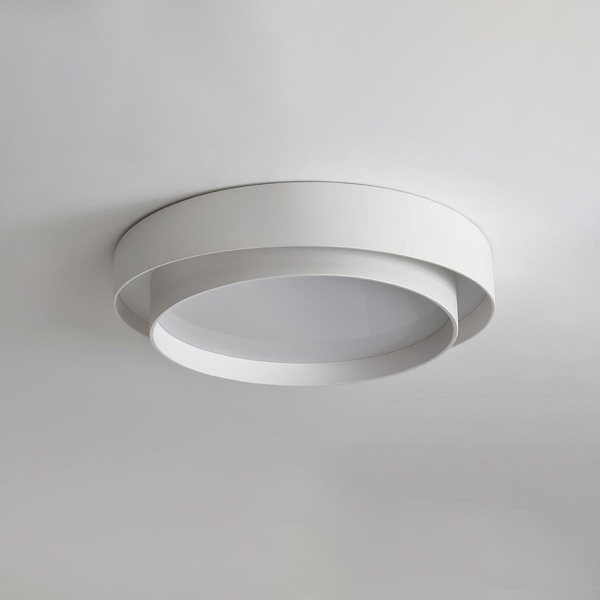 Unlit wlip white double-ring flush mount isolated against a white ceiling, showcasing its ultra-modern silhouette