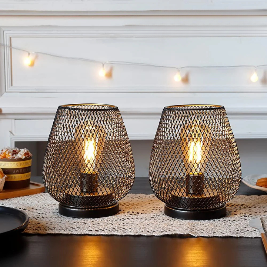 Battery-powered xolu metal mesh table lamps casting a warm, romantic glow for an intimate dining setting