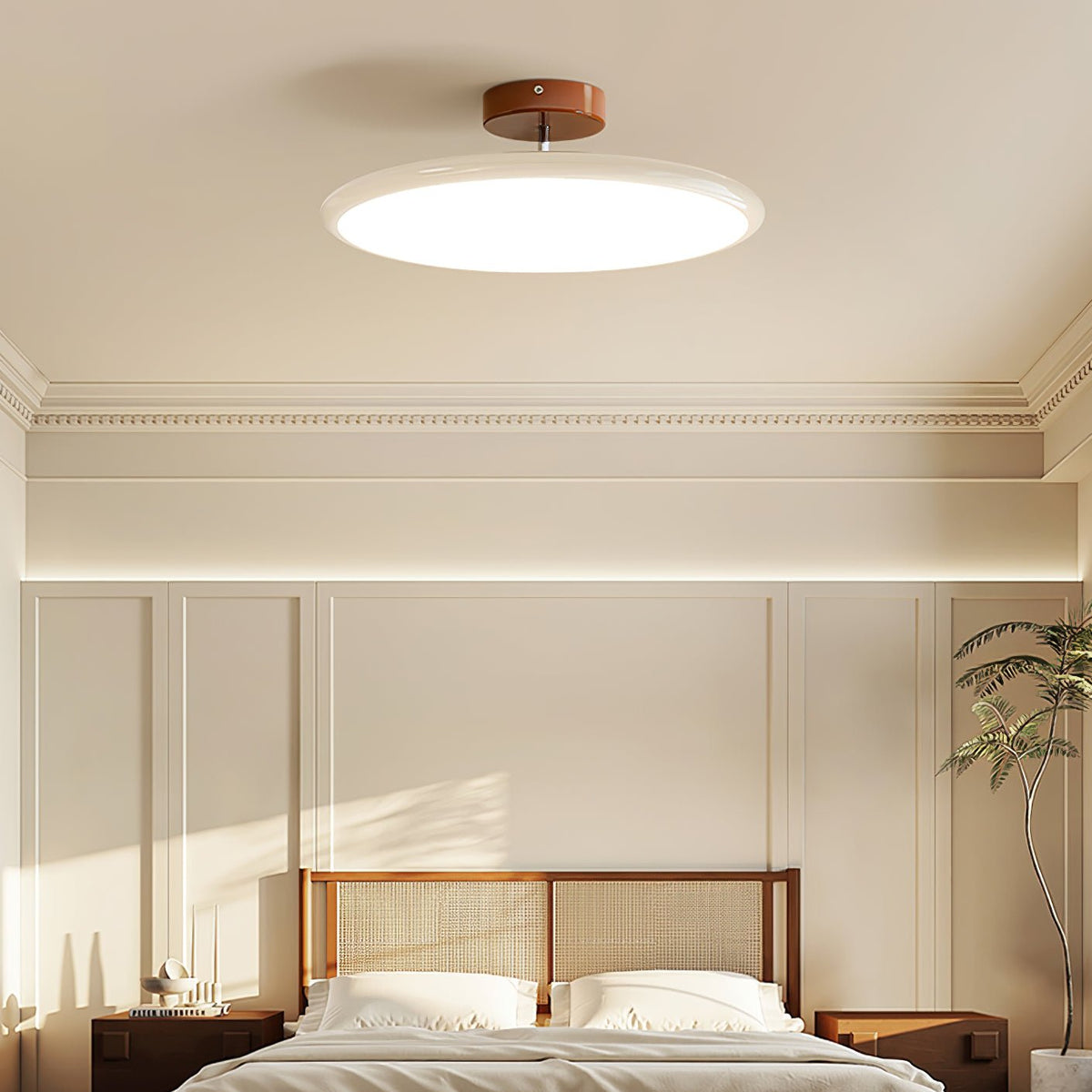 Beige rotatable LED xome ceiling light providing bright ambient illumination in a modern bedroom