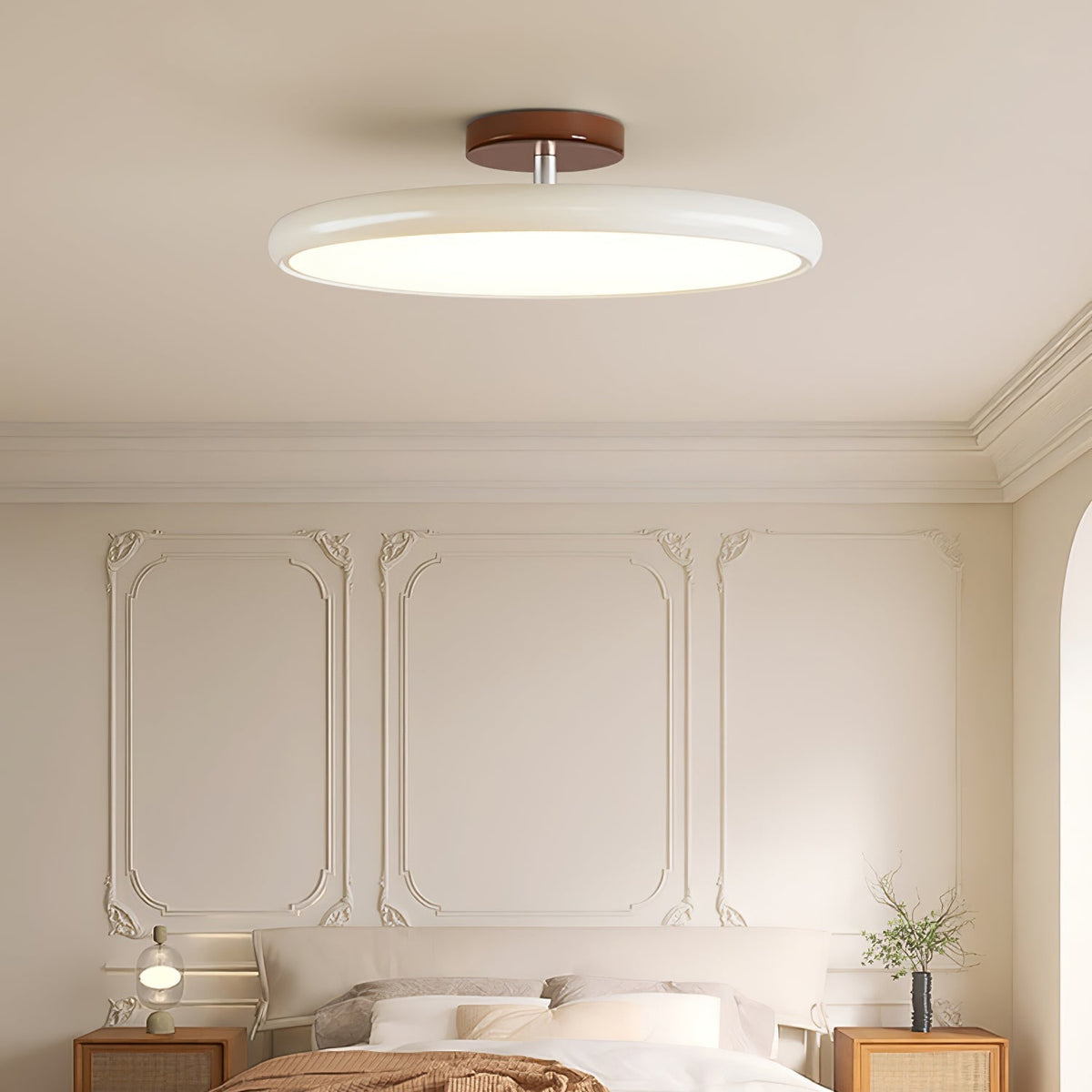 Beige rotatable flush mount xome ceiling light illuminating a stylish bedroom with wall panelling
