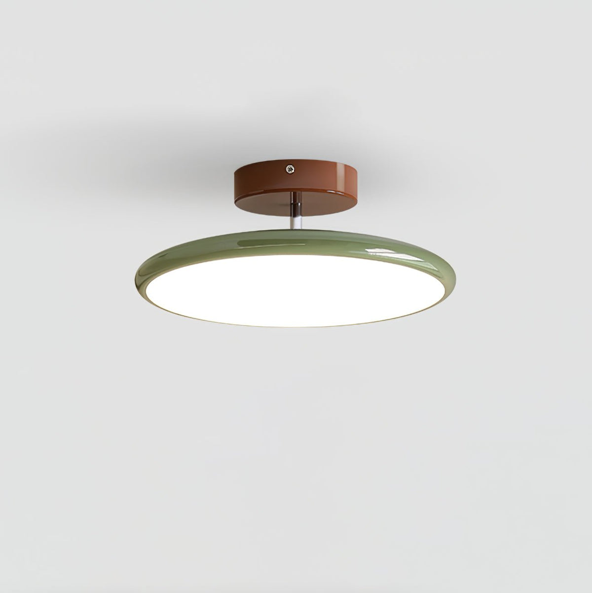 Green variant of the modern adjustable LED flush mount xome ceiling light isolated on a grey background