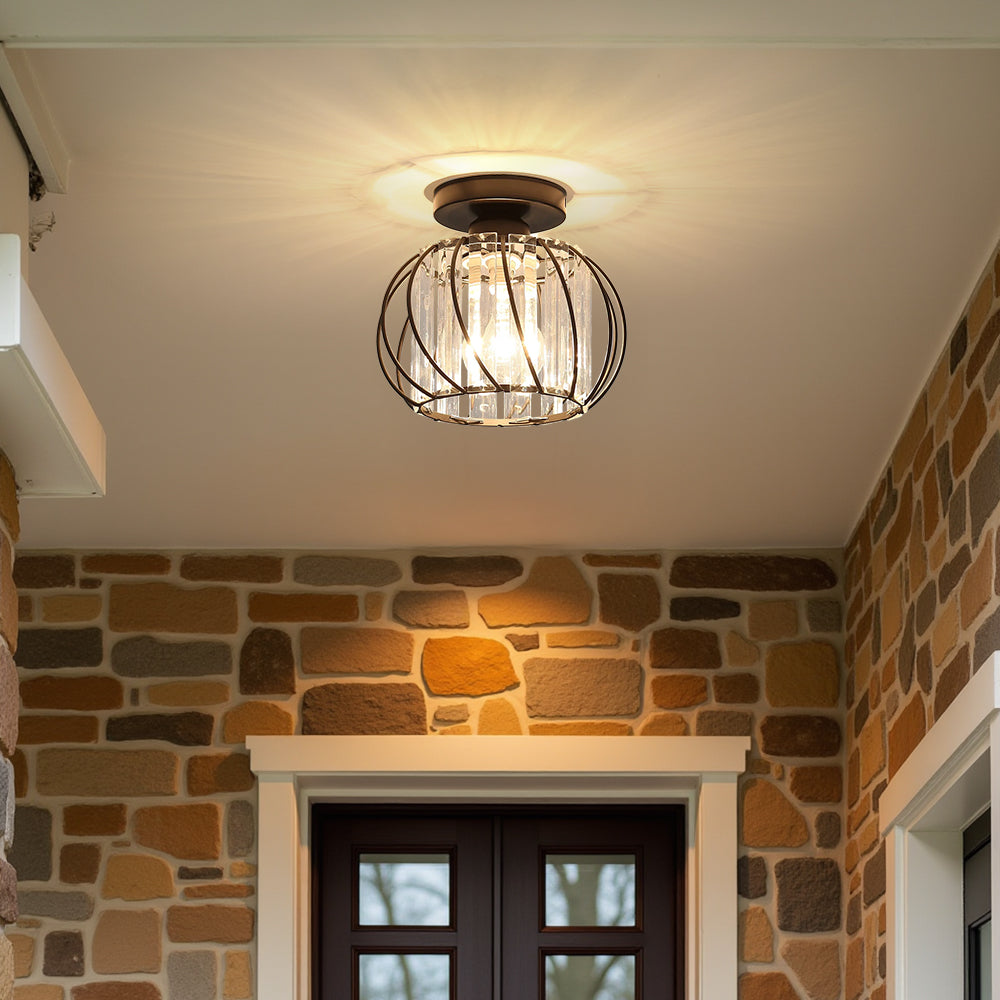 Modern black glass globe flush mount yilo light accenting a rustic stone wall interior