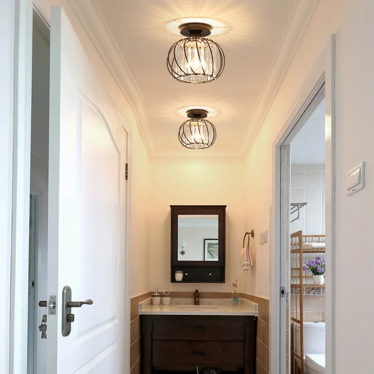Black Nordic crystal cage yilo ceiling lamp installed in a bright home entryway
