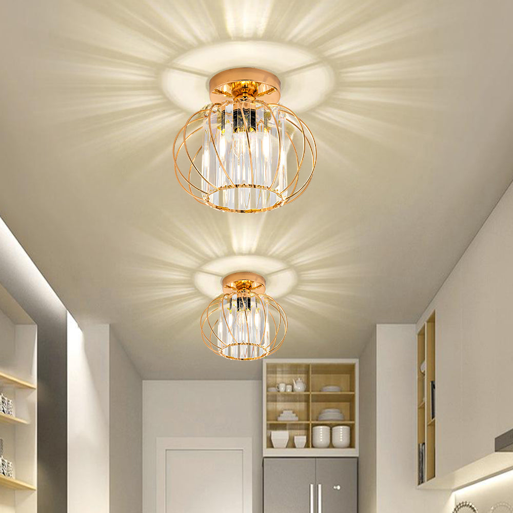 Two elegant gold crystal cage flush mount yilo ceiling lights casting warm starburst patterns in a white hallway