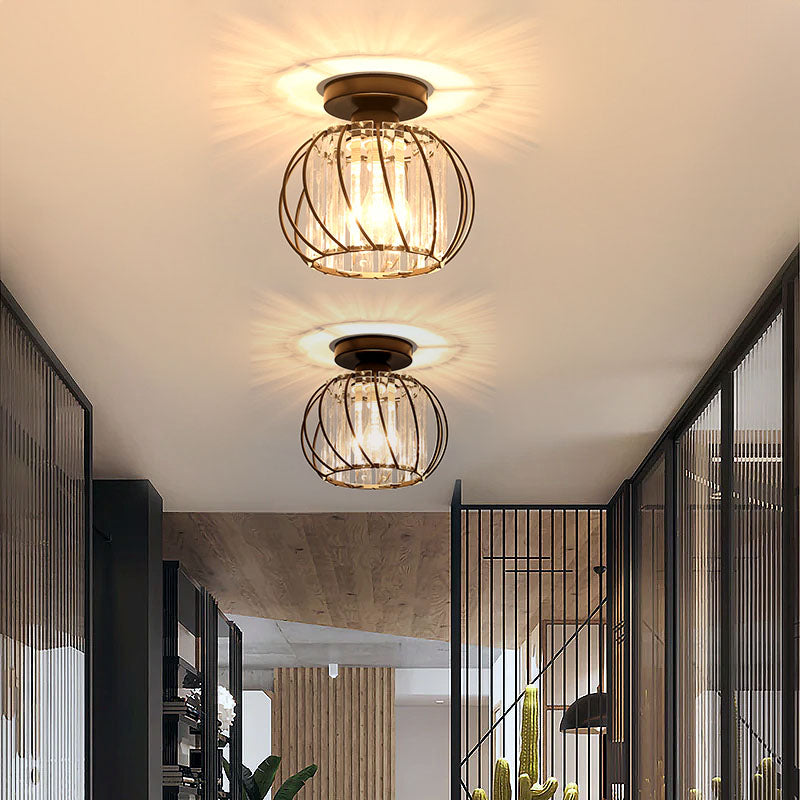 Pair of modern black crystal flush mount yilo ceiling lights illuminating a contemporary corridor