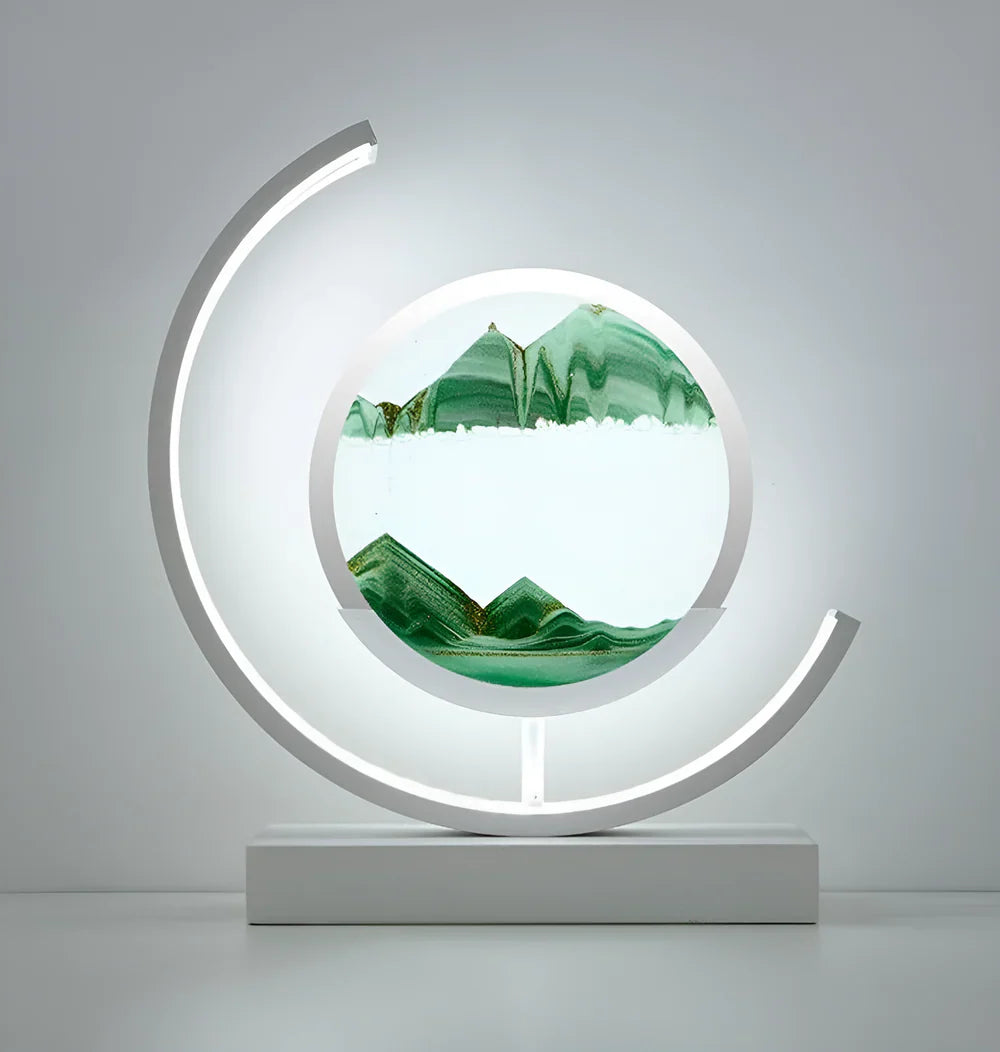White youj moving sand art fixture with green falling sand isolated on a clean, light background