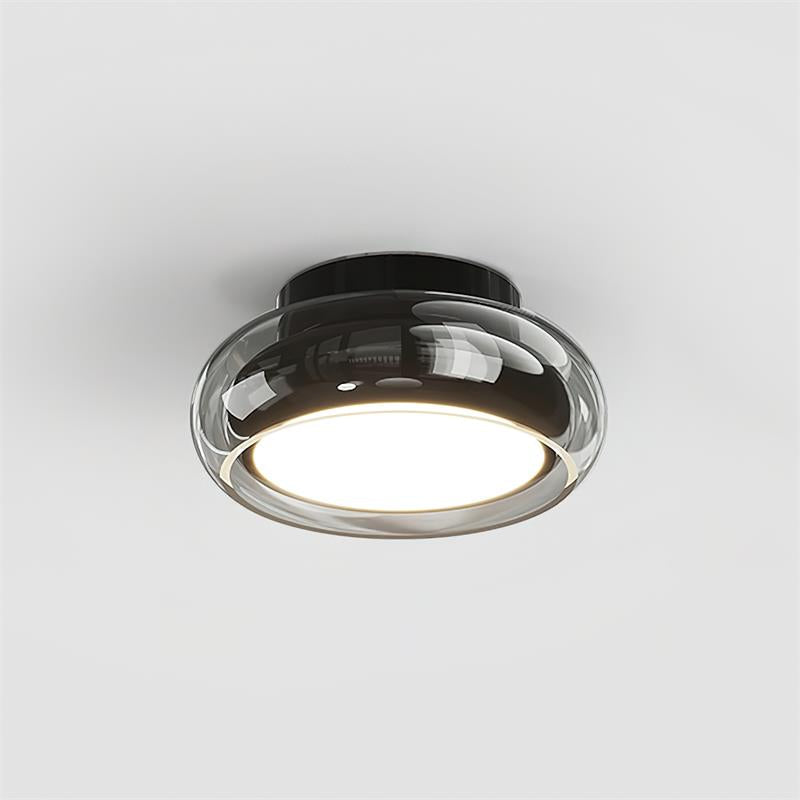 Sleek black base and smoke grey tinted glass flush mount zuba ceiling light isolated on white