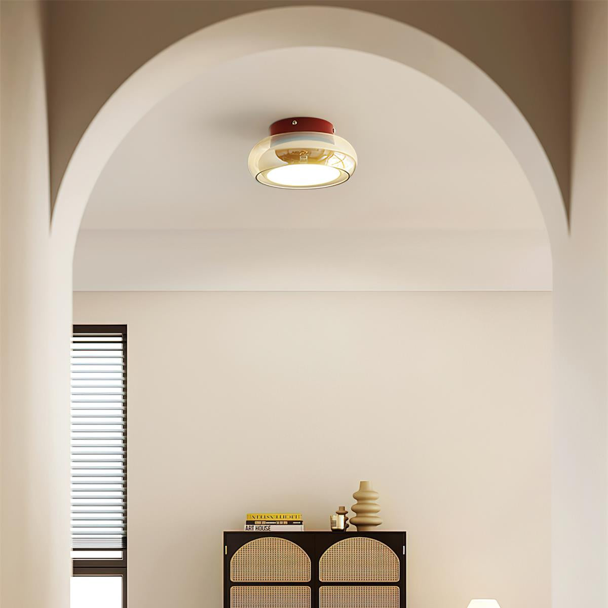 Retro amber zuba ceiling light installed in a bright minimalist interior with an arched doorway